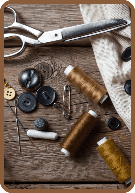 Sewing supplies on wooden table.
