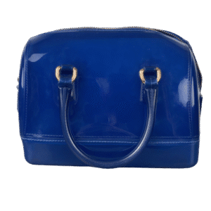 A shiny blue handbag with gold accents and two handles.
