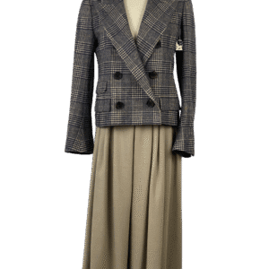 A stylish plaid blazer paired with a long beige skirt.